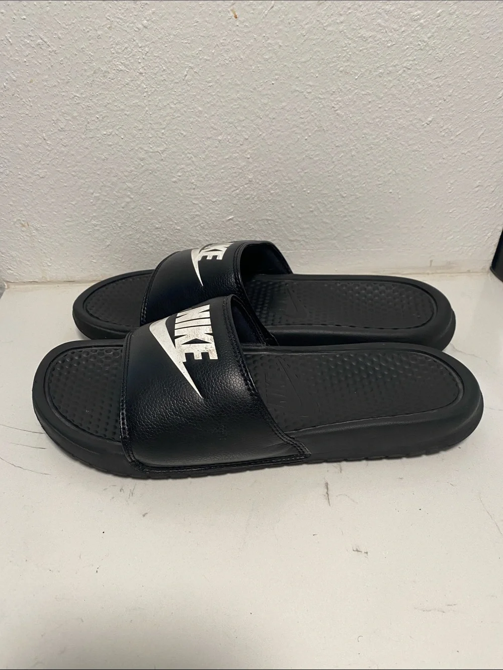 Nike Black Slide Sandals with White Swoosh Logo - Kids